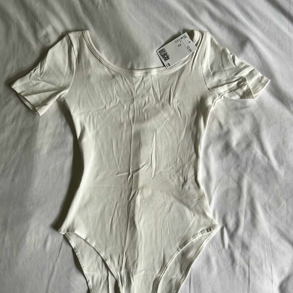 H&M size XS white bodysuit, with tags. Never worn